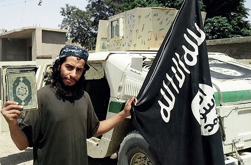 This undated image made available in the Islamic State's English-language magazine Dabiq, shows Abdelhamid Abaaoud, identified by French authorities as the presumed mastermind of the terror attacks last Friday in Paris that killed more than a hundred people and injured hundreds more. 