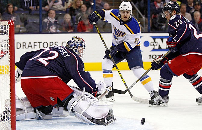 Columbus Blue Jackets goalie Sergei Bobrovosky (72), left, of Russia, stops a shot by St. Louis BLues' Robby Fabbri (15) as Blue Jackets' Cody Goloubef (29) looks on during the first period of an NHL hockey game in Columbus, Ohio, Tuesday, Nov. 17, 2015. 