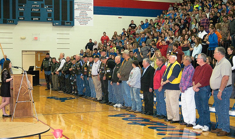 Lauren Ziehmer is behind the podium as more than 20 veterans are recognized at the California School Veterans Day Assembly, Wednesday, Nov. 11. 
