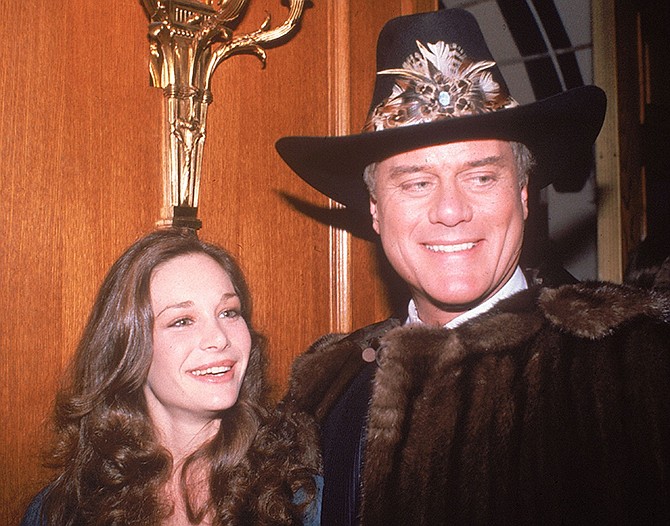 Actress Mary Crosby, daughter of late entertainer Bing Crosby, and actor Larry Hagman, who plays J.R. Ewing in the popular TV series "Dallas," appear in 1980 at a party in Los Angeles. Crosby starred as Kristin Shepard, the sister of Sue Ellen, and the woman who shot J.R. 