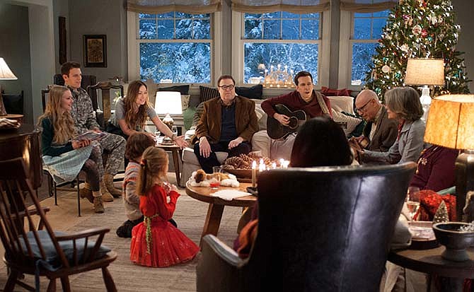 This photo provided by CBS Films and Lionsgate shows, Amanda Seyfried, from left, as Ruby, Jake Lacy, as Joe, Olivia Wilde, as Eleanor, Maxwell Simkins, as Bo, Blake Baumgartner, as Madison, John Goodman, as Sam, Ed Helms, as Hank, Alan Arkin, as Bucky, Diane Keaton as Charlotte, and Alex Borstein (back to camera), in "Love the Coopers," released by CBS Films and Lionsgate.