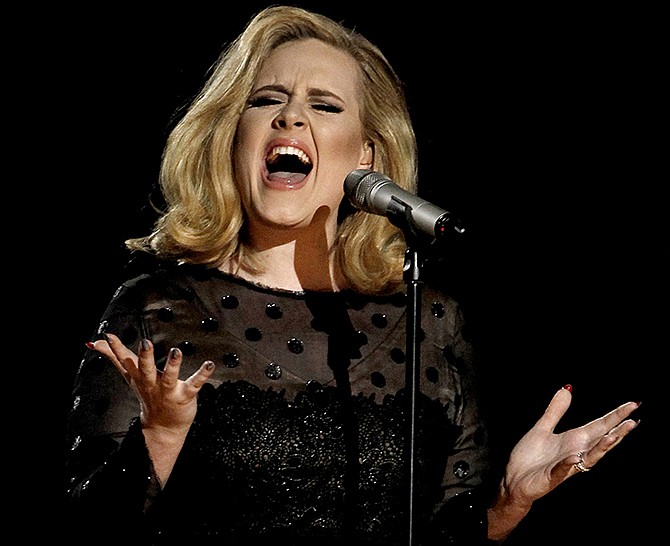 Adele performs during the 54th annual Grammy Awards in 2012 in Los Angeles. The singer's hotly anticipated new album, "25," is out today.