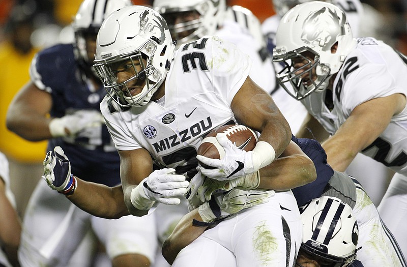 AP
Missouri running back Russell Hansbrough picks up yards during the second half of last Saturday night's game against BYU at Arrowhead Stadium.