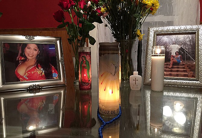 This Monday, Aug. 17, 2015 photo provided by Randall Jenson, lead advocate of the Kansas City Anti-Violence Project, shows an altar made by the friends of Tamara Dominguez during a memorial service for her at her home. Dominguez was run over multiple times and left to die on a Kansas City street. For a few transgender Americans, this has been a year of glamour and fame. For many others, 2015 has been fraught with danger, violence and mourning. (Randall Jenson/Kansas City Anti-Violence Project via AP)