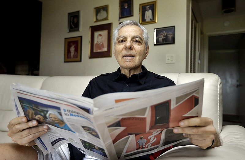 Sal Natale looks over a Medicare brochure at his home in Seminole, Florida. Rising drug costs are starting to hit Medicare's popular prescription drug program, with many senior citizens looking at double-digit premium increases next year.