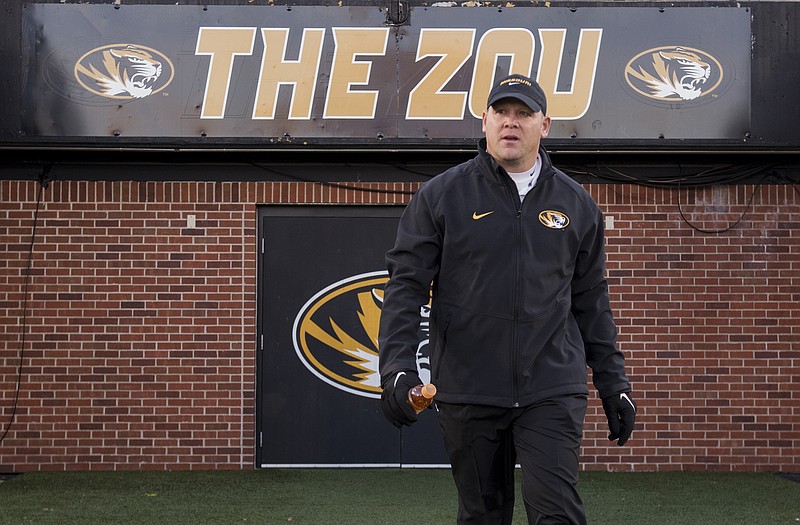 Missouri defensive coordinator Barry Odom, shown walking onto the field before the start of Saturday's game with Tennessee in Columbia, finds himself at the center of discussions about who should replace Gary Pinkel as head coach of the Tigers.