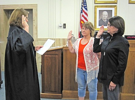 Family Court Judge Sue Crane swears in Minnie Via and Jerrie Bell before they take on their duties as court appointed advocates for children. There were, at last count, 156 abused and neglected children in Callaway County. CASA volunteers become their voice in the system.