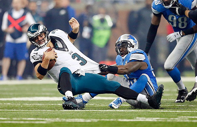 Philadelphia Eagles quarterback Mark Sanchez (3) is sacked by Detroit Lions middle linebacker Stephen Tulloch (55) during the second half of an NFL football game, Thursday, Nov. 26, 2015, in Detroit. 