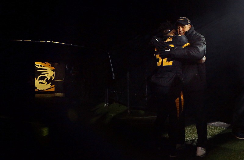 Missouri head coach Gary Pinkel embraces running back Russell Hansbrough during pregame introductions before last Saturday night's game against Tennessee at Faurot Field. In addition to Senior Day, it was Pinkel's final home game at Missouri.