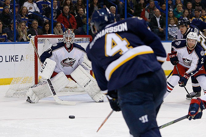 Columbus Blue Jackets goalie Sergei Bobrovsky, of Russia, prepares to block a shot on goal from St. Louis Blues' Carl Gunnarsson, of Sweden, during the second period of an NHL hockey game Saturday, Nov. 28, 2015, in St. Louis.