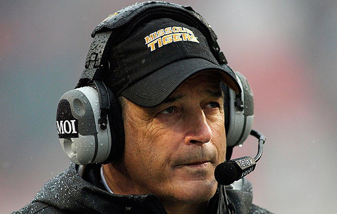 Missouri's Gary Pinkel watches from the sidelines during the first half of an NCAA college football game against Arkansas, Friday, Nov. 27, 2015, in Fayetteville, Ark.