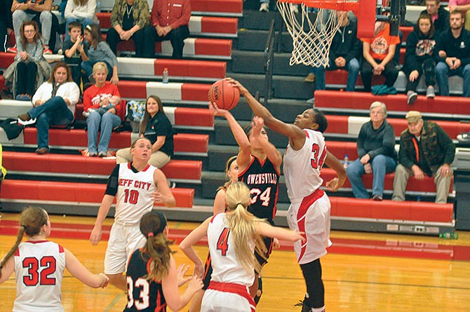 Nicole Martin of Jefferson City blocks the shot attempt of Hailey Diestelkamp of Owensville during Saturday afternoon's game at the St. James Shootout.