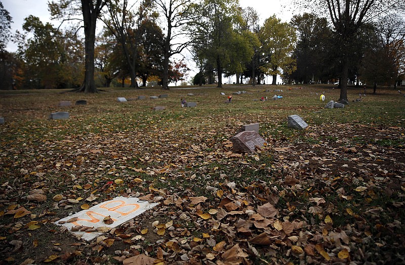 In this photo taken Nov. 5, Michael Brown's gravesite, lower left, is shown in Normandy. More than 15 months since his life ended at age 18, Brown is among the most-famous residents of 160-year-old St. Peter's Cemetery, though there is still no headstone marking his grave.