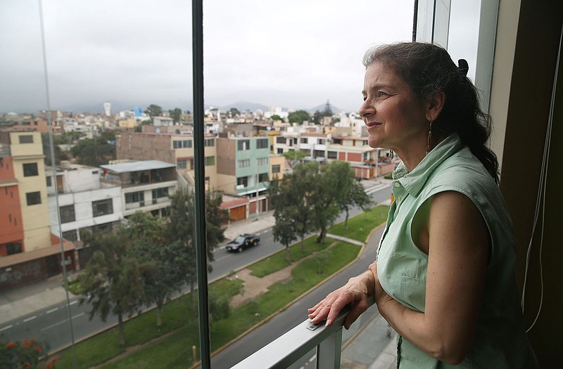 US. activist Lori Berenson looks out from her residence in Lima, Peru, on Friday.
