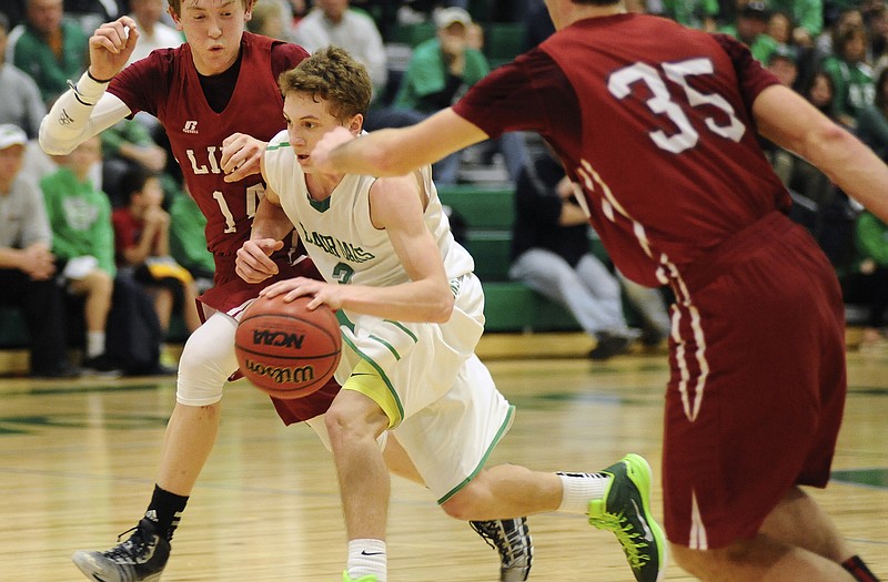 Blair Oaks' Cody Alexander, shown splitting a pair of Linn defenders during a game last season in Wardsville, is one of several returning Falcons with varsity experience.