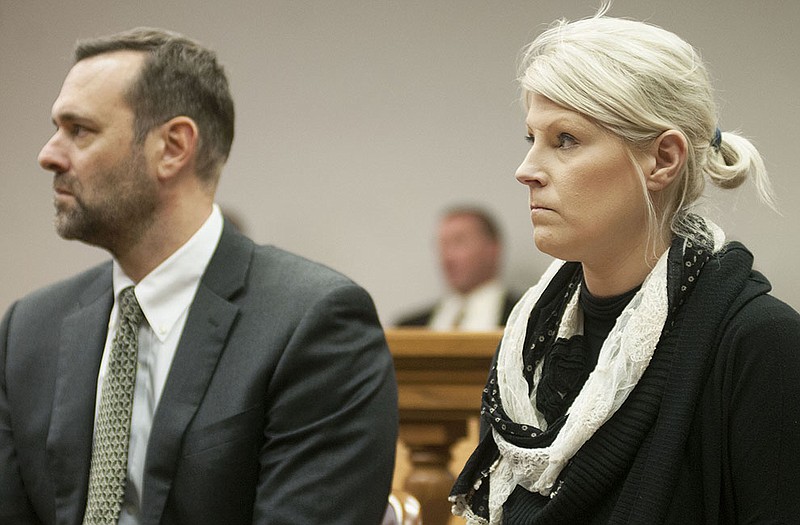 Ann Metternich, a former Jefferson City businesswoman, and her attorney listen to Cole County Judge Dan Green (not pictured) impose a sentence on Wednesday, Dec. 2, 2015, following her conviction of stealing.