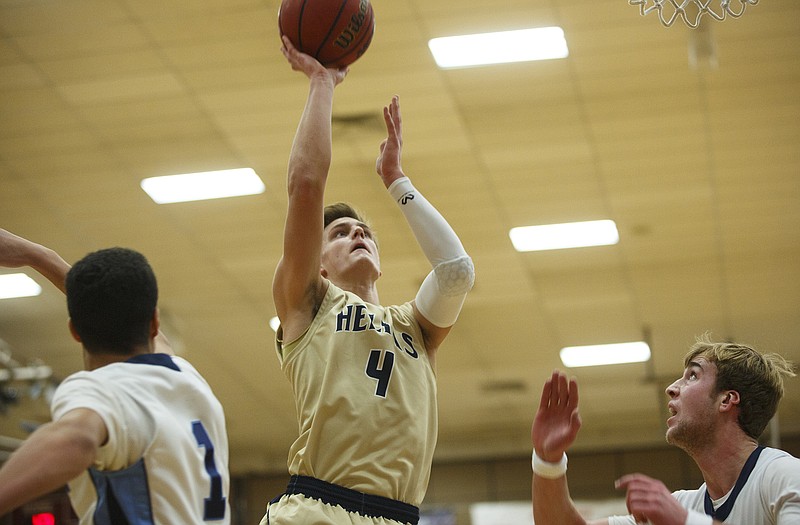 Adam Bax should provide a strong inside presence this season for the Helias Crusaders.