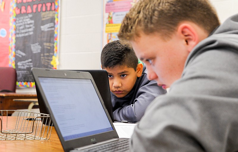 Jose Magana and William Phillips work on independent English lessons using the 1:1 Chromebooks provided for each English and Science classroom at the California Middle School this school year.