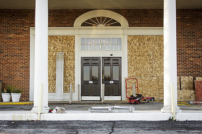 The Truman Hotel's main entrance is boarded up after the Jefferson Street hotel closed its doors Monday, Nov. 30, 2015.