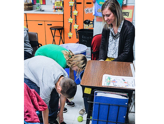 Student teacher Hannah Wilson discusses multiplication with fourth graders in Cindy Wieberg's Russellville Elementary School classroom. 
