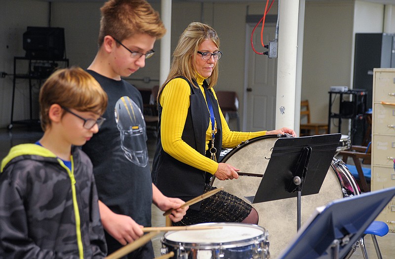 Russellville Middle School principal Elaine Buschjost has been a student in beginning band this semester, learning to play percussion alongside her sixth-grade classmates.