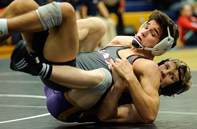 Jefferson City's Tanner Irwin does battle with Eureka's Kyran Hagan on Friday at the Missouri Duals.