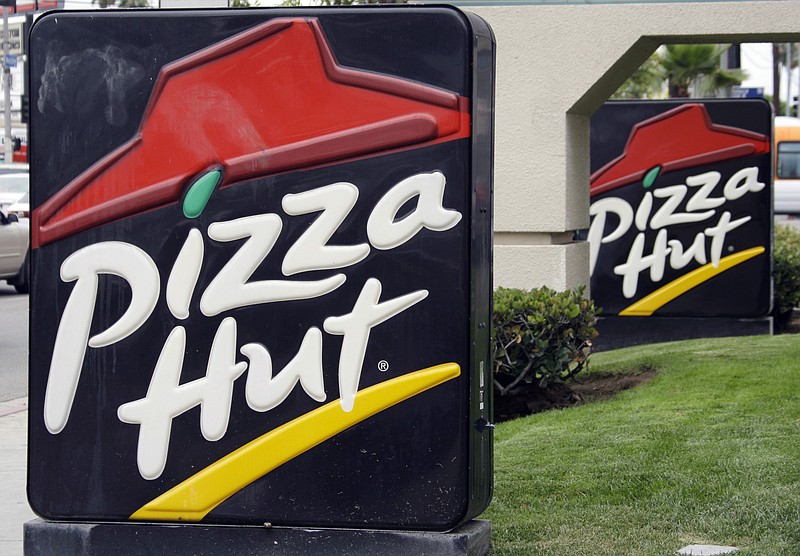 This  file photo shows a Pizza Hut restaurant in Los Angeles Tuesday, Oct. 5, 2010. Yum CEO Greg Creed thinks he figured out why Pizza Hut can't shake its sales slump: The chain needs to be more like the car-hailing service Uber. "If you think about the Uber experience, it's easy to use, it's easy to pay, it's very easy to track," Creed said in a phone interview from Dallas late Thursday, Dec. 10, 2015 after Yum Brands' investor day. During the presentation, Creed had noted there was a time when the way to beat the competition was to have a better product. Now, convenience trumps quality.