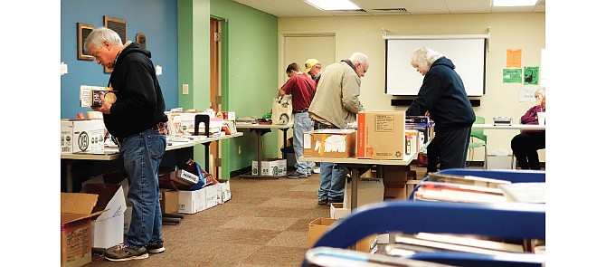 Library patrons and other book lovers shop the book sale at the Callaway County Public Library in Fulton on Thursday.