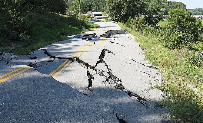 Lower Bottom Road in Cole County was closed on July 6, 2015, after these gaping cracks developed in the roadway following heavy rains in June. (News Tribune file photo)