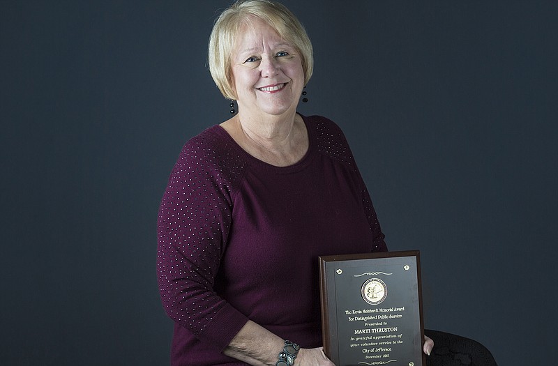 Marti Thruston is the recipient of the 2015 Kevin Meinhardt award for distinguished public service. She was honored for her work on the USS Jefferson City Submarine Committee.