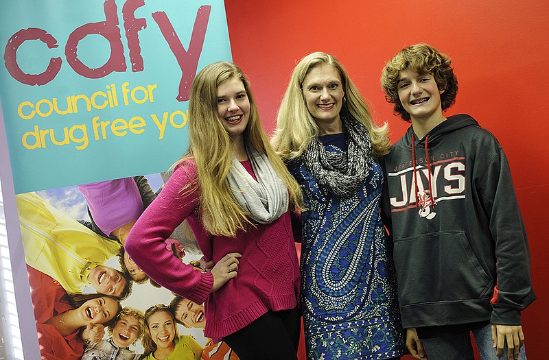 Denise Gillam, center, and her children Marie, left, and David Gillam. All three are active with the Safety Kids Program.