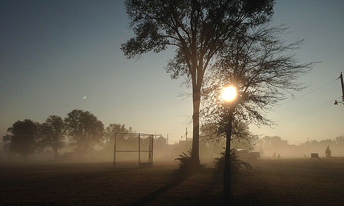 The rising sun burns off the early morning fog in this photo in Mid-Missouri.