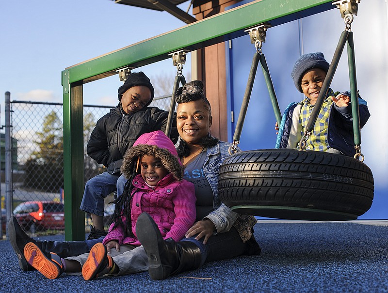 Desiree Edwards and her children, Damarion, Brooklyn and Dakari, are shown at Jefferson City Day Care Center.