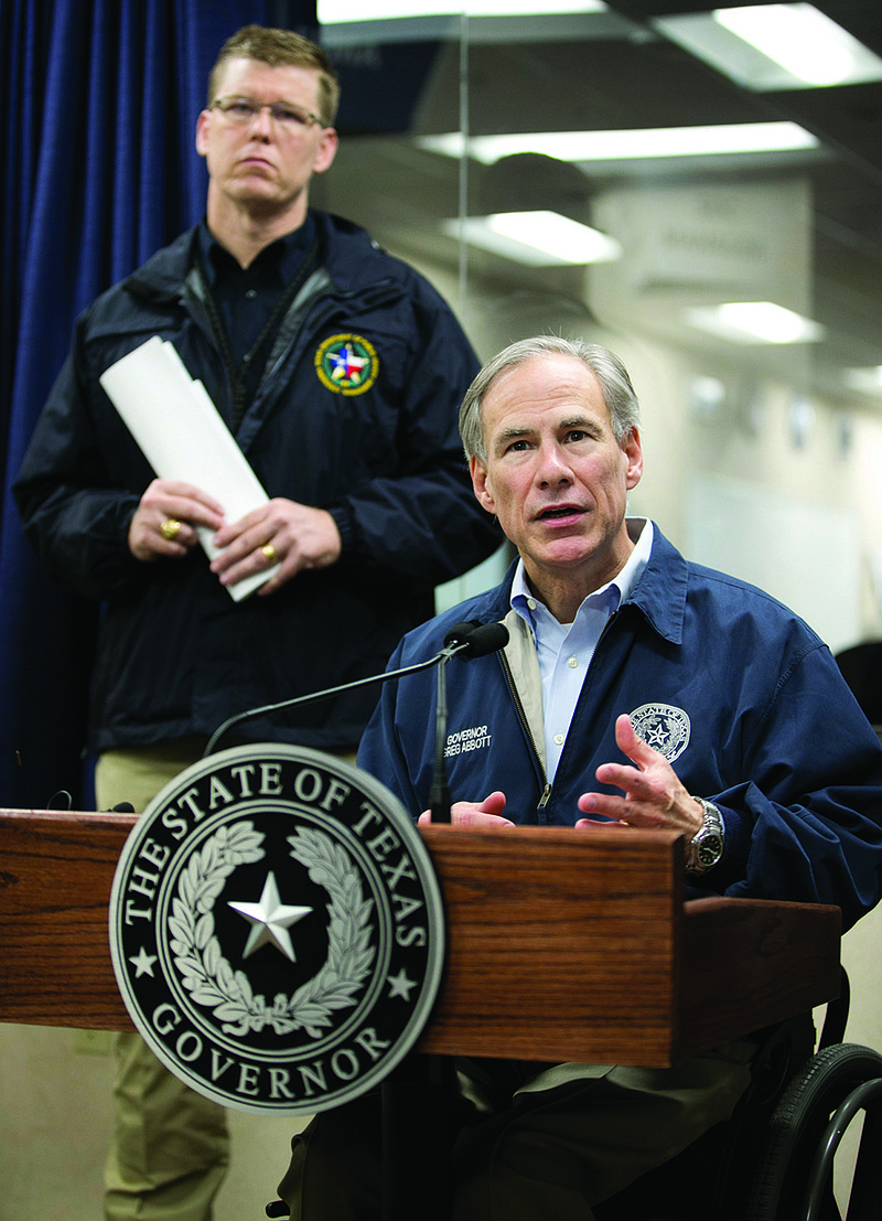 Gov. Greg Abbott talks about the severe weather Sunday in Texas at the DPS State Operations Center in Austin.
