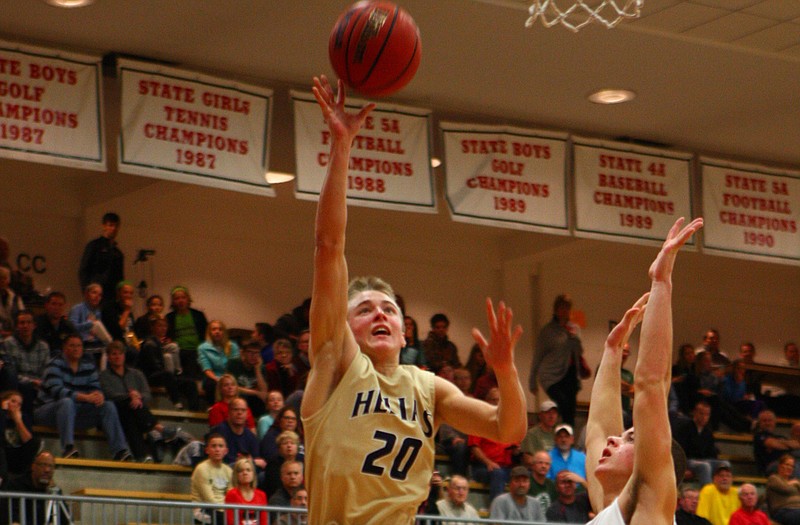 Landon Harrison of Helias puts up a shot during Monday's game against Owasso, Okla., at Fleming Fieldhouse.