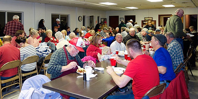 Tebbetts community members and other local residents gather for a Community Dinner chili cook-off Friday, Jan. 1, 2016.