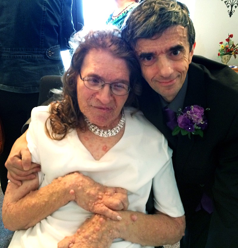 Beth Brandt and John Hamelin pose for a picture just before their wedding ceremony Dec. 5, 2015, at Legacy, an assisted-living home in Ulysses, Kan. Despite the challenges of daily living, in front of a congregation of more than a hundred friends and family, John Hamelin, 56, and Brandt, 54, promised to live as one.