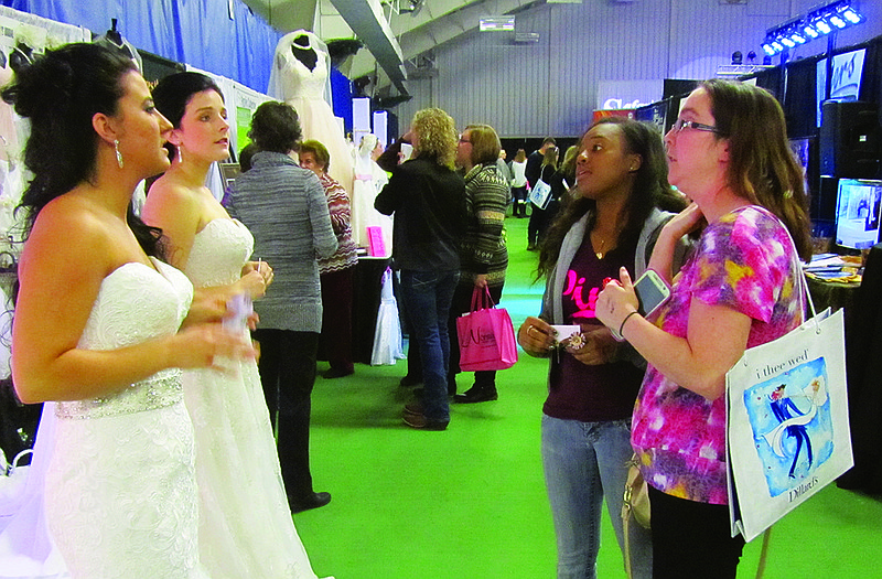 From left, live models Samantha Tracy and Sarah Sullentrop chat with Crystal Glaze and Ashley Forck at Sunday's 2016 Bridal Spectacular at the Firley YMCA. Tracy and Sullentrop modeled for Kay's Bridal and Tuxedo in Sedalia. Glaze accompanied Forck, who is planning an April 16 wedding.