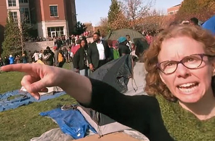 MU mass media instructor Melissa Click is seen in this frame grab from Mark Schierbecker's video as she tries to squelch coverage of a protest celebration on the university quadrangle.
