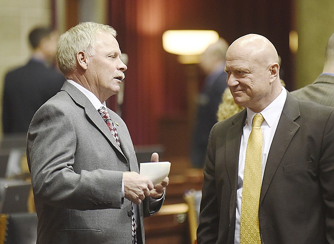 Representatives Randy Pietzman, R-Troy, left, and Mike Bernskoetter, R-Jefferson City, talk at the conclusion of Wednesday's opening day session of the Missouri Legislature. 