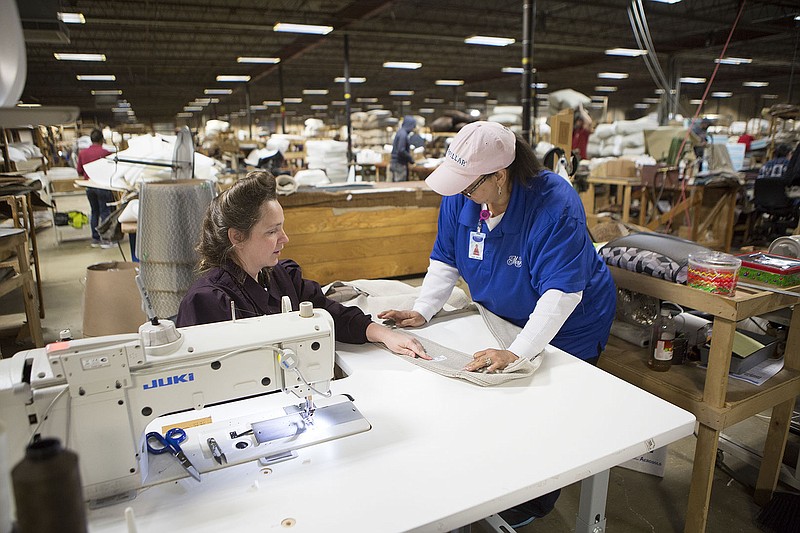 Lara Steed works with Gwen Whistle, a trainer in the upholstery department at Mayo Manufacturing, the morning of Thursday, Jan. 07, 2016. The company received a grant through Texas Workforce Commission to expand labor pool and training programs. JCM Industries and Texarkana College also received workforce development funds.