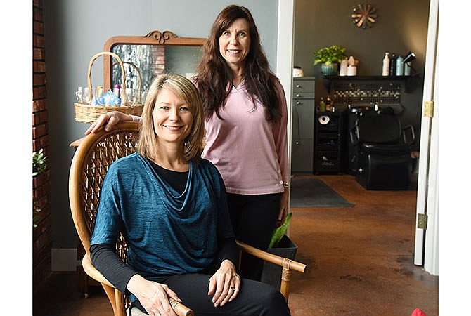 Mo Willoh, seated, and Doris Guillory pose in their new business combination, Willoh Essentials and Loving Hands Massage, at 328 E. Capitol Ave. in Jefferson City.