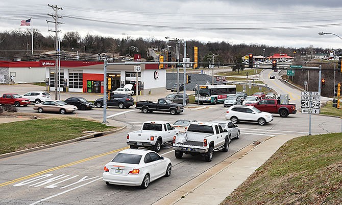 Traffic passes through the Jefferson City intersection of Jefferson Street and Stadium Drive on Friday, Jan. 8, 2016. The city is pursuing a plan to build a roundabout at the intersection. 