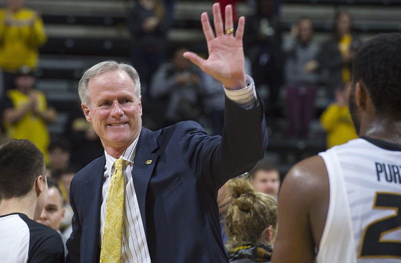 Missouri coach Kim Anderson prepares a high-five for Kevin Puryear after Saturday night's win against Auburn at Mizzou Arena.