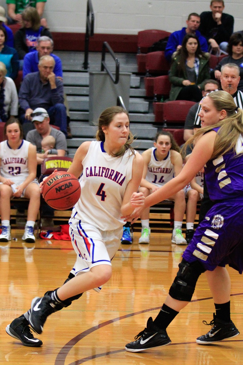 Lady Pinto Ashtyn Goans heads towards the basket during the Hallsville overtime time game at the Tri-County Conference in Eldon.