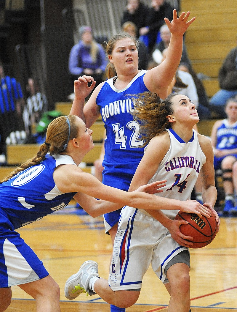 California Lady Pinto Elizabeth Lutz makes through the tough Boonville defense Monday at California High School.