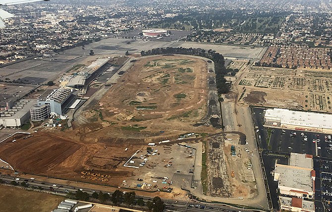 In this Feb. 20, 2015, aerial file photo taken from the window of a commercial airliner, the site of the former Hollywood Park horse-racing track stands in Inglewood, Calif. NFL owners voted Tuesday night, Jan. 12, 2016, to allow the St. Louis Rams to move to a new stadium at the site just outside Los Angeles, and the San Diego Chargers will have an option to share the facility. The Oakland Raiders, who also wanted to move to the area, could move to Los Angeles if San Diego doesn't, Commissioner Roger Goodell said. (AP Photo/Oscar W. Gabriel, File)