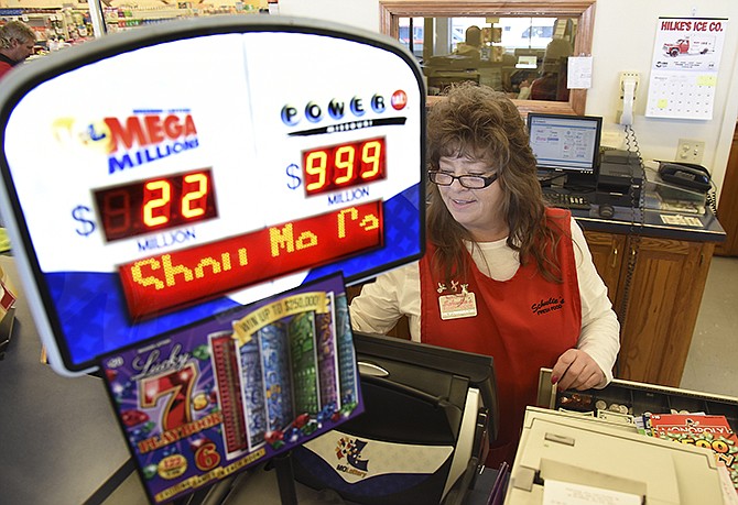 The largest Powerball in history is keeping cashiers like Tammy Pearon very busy. Pearon works in the customer service department at Schulte's Fresh Foods and said people were lined up at 6 a.m. Wednesday morning to purchase their shot at winning a fortune. The Missouri Lottery informational board only registers three digits so even though the amount is well over it, it only reads $999 million. 