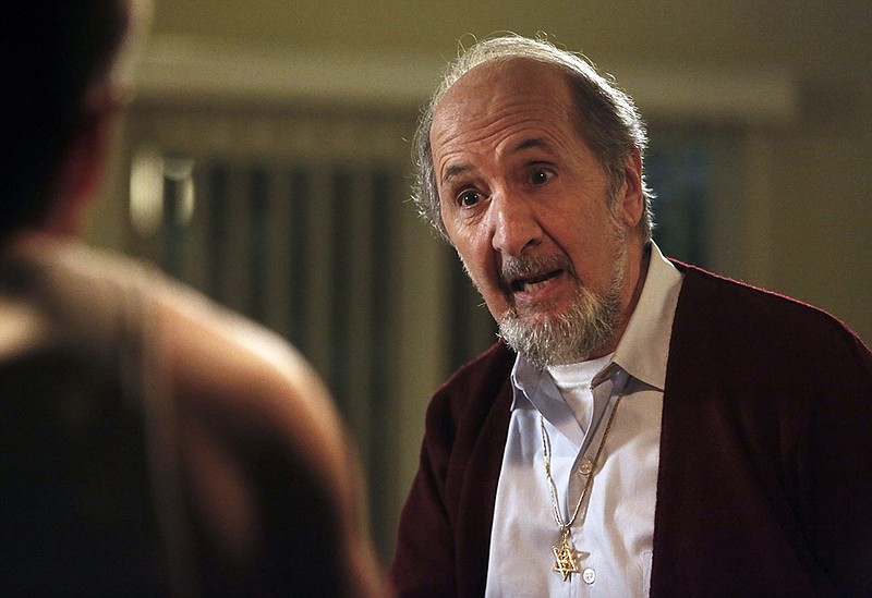 This photo provided by courtesy of NBC shows Richard Libertini as Saul Hodiak in season one of the TV series, "Aquarius." The comedic character actor Libertini has died at age 82. Libertini's ex-wife Melinda Dillon says he died Jan. 7, 2016, after a 2-yearlong battle with cancer.