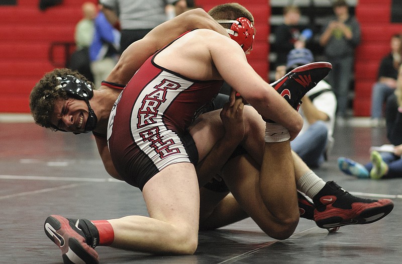 Jalen Martin of Jefferson City tangles with Park Hill's Jacob Sobbing during their 195-pound match Friday night in the Capital City Invitational at Fleming Fieldhouse. Martin won the match 10-0.